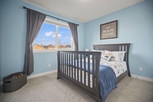 411 River Heights Crescent, Cochrane, AB - Indoor Photo Showing Bedroom