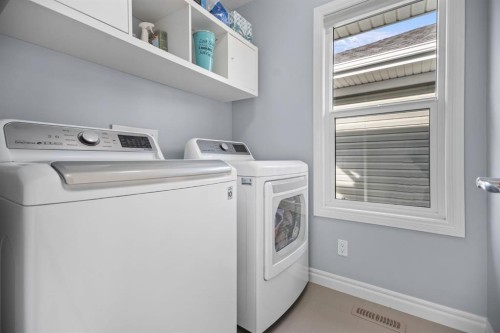 411 River Heights Crescent, Cochrane, AB - Indoor Photo Showing Laundry Room