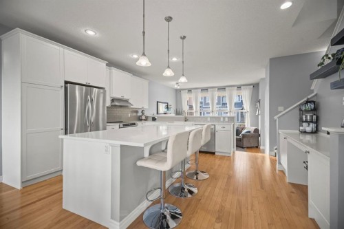 411 River Heights Crescent, Cochrane, AB - Indoor Photo Showing Kitchen With Upgraded Kitchen