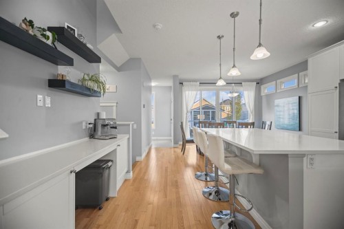 411 River Heights Crescent, Cochrane, AB - Indoor Photo Showing Kitchen With Upgraded Kitchen