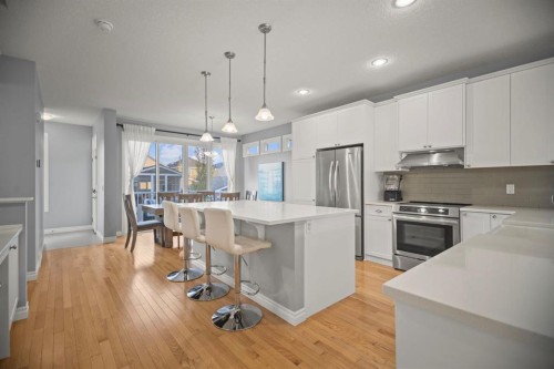 411 River Heights Crescent, Cochrane, AB - Indoor Photo Showing Kitchen With Upgraded Kitchen