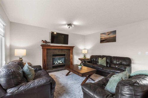 7 Everglade Circle Sw, Calgary, AB - Indoor Photo Showing Living Room With Fireplace