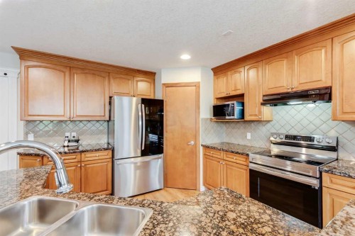 7 Everglade Circle Sw, Calgary, AB - Indoor Photo Showing Kitchen With Stainless Steel Kitchen With Double Sink