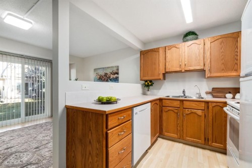 12 Millrise Green Sw, Calgary, AB - Indoor Photo Showing Kitchen With Double Sink