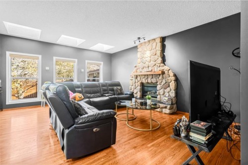 18352 Chaparral Street Se, Calgary, AB - Indoor Photo Showing Living Room With Fireplace