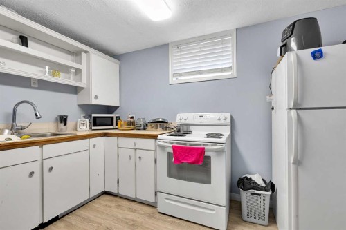 4617 Stanley Road Sw, Calgary, AB - Indoor Photo Showing Kitchen With Double Sink