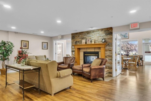 314-4500 50 Avenue, Olds, AB - Indoor Photo Showing Other Room With Fireplace