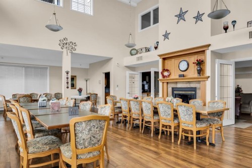 314-4500 50 Avenue, Olds, AB - Indoor Photo Showing Dining Room With Fireplace