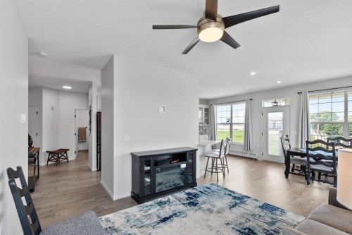 314-4500 50 Avenue, Olds, AB - Indoor Photo Showing Living Room With Fireplace