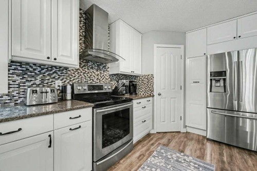 35 Somerglen Way Sw, Calgary, AB - Indoor Photo Showing Kitchen With Stainless Steel Kitchen With Upgraded Kitchen