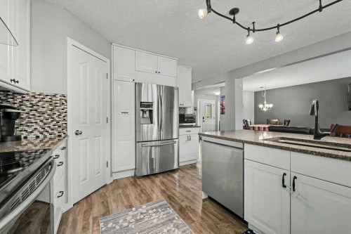 35 Somerglen Way Sw, Calgary, AB - Indoor Photo Showing Kitchen With Stainless Steel Kitchen With Upgraded Kitchen