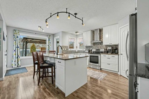 35 Somerglen Way Sw, Calgary, AB - Indoor Photo Showing Kitchen With Stainless Steel Kitchen With Upgraded Kitchen