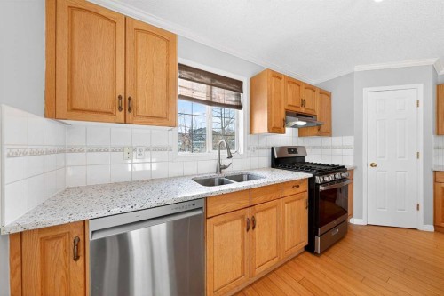 169 Harvest Grove Close Ne, Calgary, AB - Indoor Photo Showing Kitchen With Double Sink
