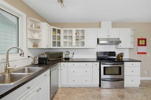 2708 Doverbrook Road Se, Calgary, AB - Indoor Photo Showing Kitchen With Double Sink