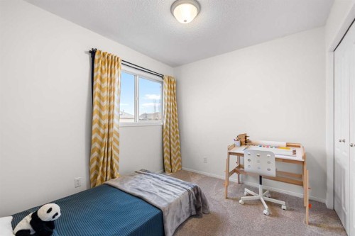 62 Canoe Circle Sw, Airdrie, AB - Indoor Photo Showing Bedroom