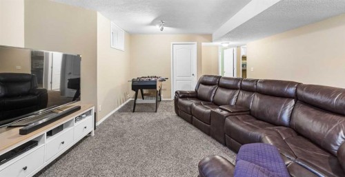 62 Canoe Circle Sw, Airdrie, AB - Indoor Photo Showing Living Room