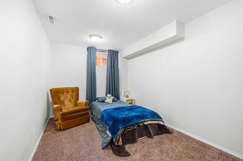 62 Canoe Circle Sw, Airdrie, AB - Indoor Photo Showing Bedroom