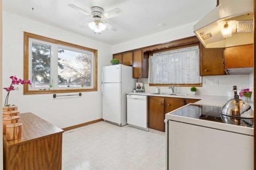 3221 Cedarille Drive Sw, Calgary, AB - Indoor Photo Showing Kitchen With Double Sink