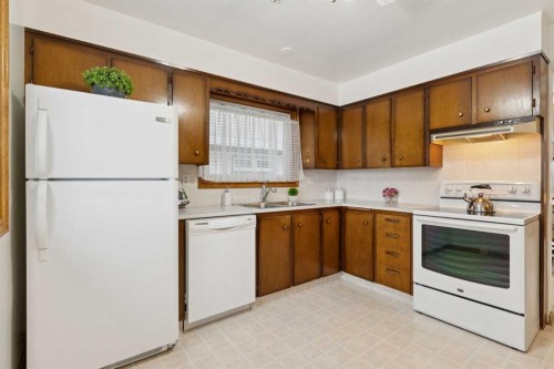 3221 Cedarille Drive Sw, Calgary, AB - Indoor Photo Showing Kitchen With Double Sink