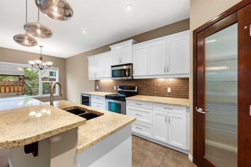 18 Aspen Hills Manor Sw, Calgary, AB - Indoor Photo Showing Kitchen With Stainless Steel Kitchen With Double Sink