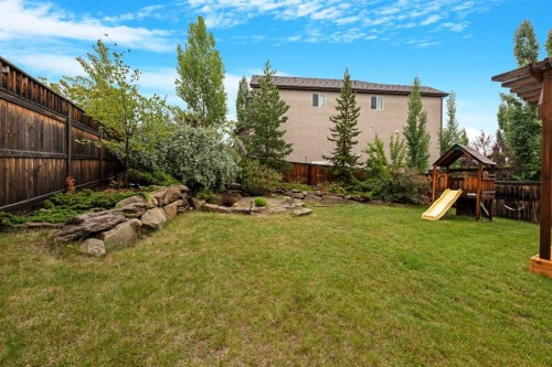 18 Aspen Hills Manor Sw, Calgary, AB - Outdoor With Backyard