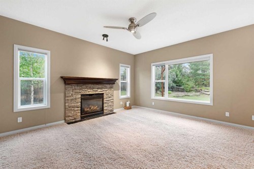 18 Aspen Hills Manor Sw, Calgary, AB - Indoor Photo Showing Living Room With Fireplace