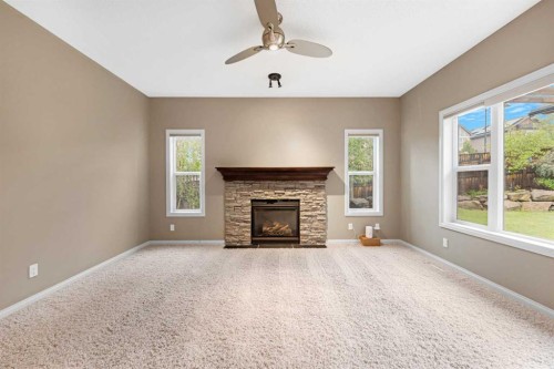 18 Aspen Hills Manor Sw, Calgary, AB - Indoor Photo Showing Living Room With Fireplace