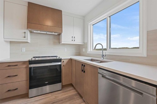 902 Wolf Willow Boulevard Se, Calgary, AB - Indoor Photo Showing Kitchen With Stainless Steel Kitchen With Double Sink With Upgraded Kitchen