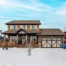 461 Boulder Creek Way Se, Langdon, AB  - Outdoor With Deck Patio Veranda With Facade 