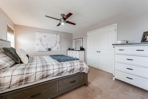 461 Boulder Creek Way Se, Langdon, AB - Indoor Photo Showing Bedroom