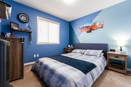 461 Boulder Creek Way Se, Langdon, AB - Indoor Photo Showing Bedroom