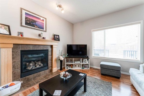 461 Boulder Creek Way Se, Langdon, AB - Indoor Photo Showing Living Room With Fireplace