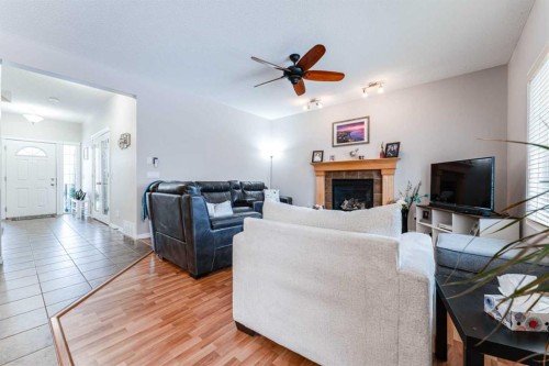 461 Boulder Creek Way Se, Langdon, AB - Indoor Photo Showing Living Room With Fireplace