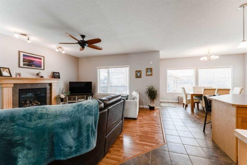 461 Boulder Creek Way Se, Langdon, AB - Indoor Photo Showing Living Room With Fireplace