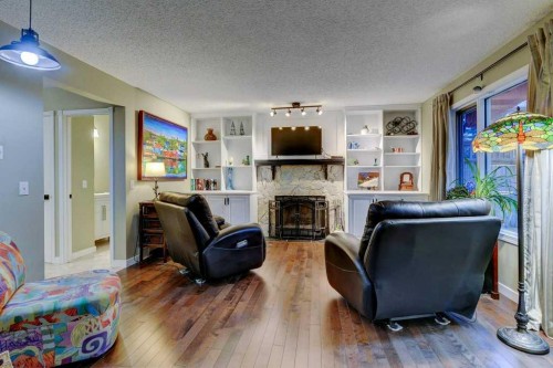 28 Hawktree Circle Nw, Calgary, AB - Indoor Photo Showing Living Room With Fireplace