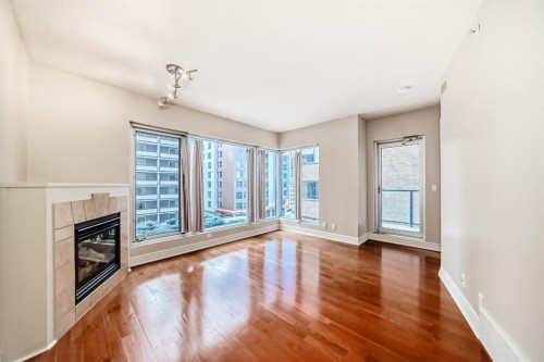 701-920 5 Avenue Sw, Calgary, AB - Indoor Photo Showing Other Room With Fireplace