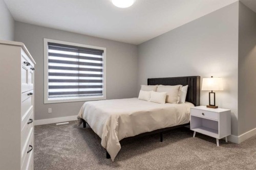 18 South Shore Bay, Chestermere, AB - Indoor Photo Showing Bedroom