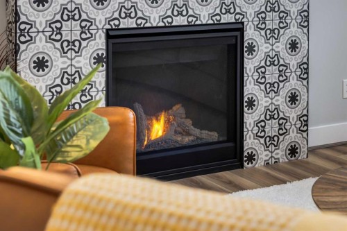 18 South Shore Bay, Chestermere, AB - Indoor Photo Showing Living Room With Fireplace