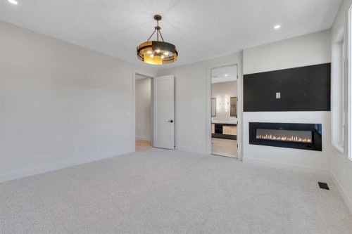 342 Normandy Drive Sw, Calgary, AB - Indoor With Fireplace