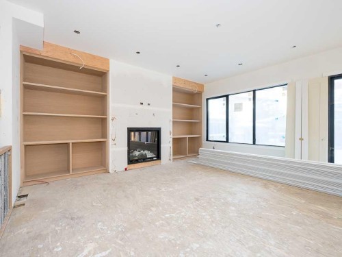 15 42 Street Sw, Calgary, AB - Indoor Photo Showing Other Room With Fireplace