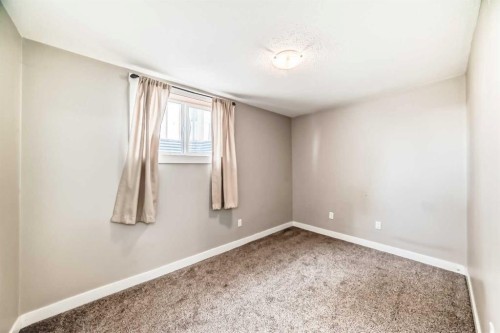 120 Martinview Close Ne, Calgary, AB - Indoor Photo Showing Other Room