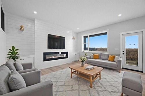 3430 Victory Way, Olds, AB - Indoor Photo Showing Living Room With Fireplace