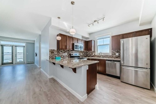 417-2300 Evanston Square Nw, Calgary, AB - Indoor Photo Showing Kitchen With Stainless Steel Kitchen With Upgraded Kitchen