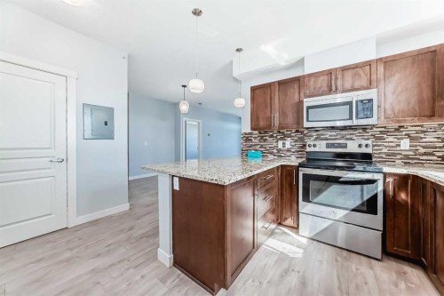 417-2300 Evanston Square Nw, Calgary, AB - Indoor Photo Showing Kitchen With Upgraded Kitchen