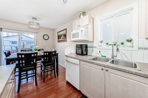 187 Taravista Street Ne, Calgary, AB - Indoor Photo Showing Kitchen With Double Sink