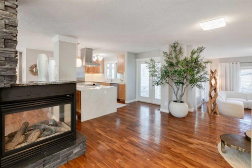38 Lissington Drive Sw, Calgary, AB - Indoor Photo Showing Living Room With Fireplace