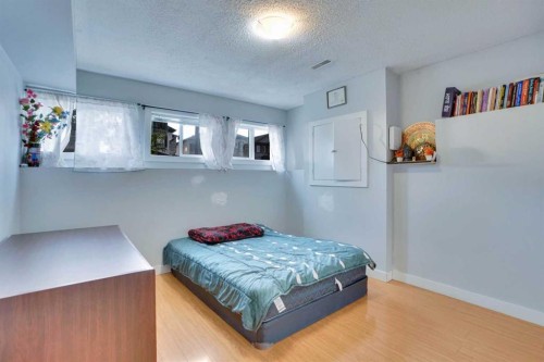 62 Taracove Estate Drive Ne, Calgary, AB - Indoor Photo Showing Bedroom