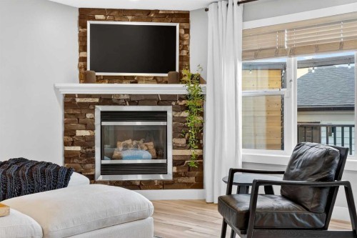 5318 Copperfield Gate Se, Calgary, AB - Indoor Photo Showing Living Room With Fireplace