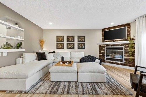 5318 Copperfield Gate Se, Calgary, AB - Indoor Photo Showing Living Room With Fireplace