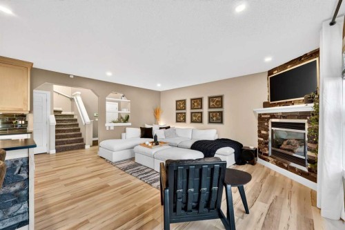 5318 Copperfield Gate Se, Calgary, AB - Indoor Photo Showing Living Room With Fireplace